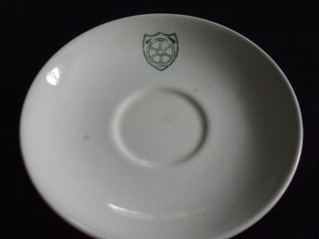 Saucer with an unknown shield monogram from Kat & Co Saucer10