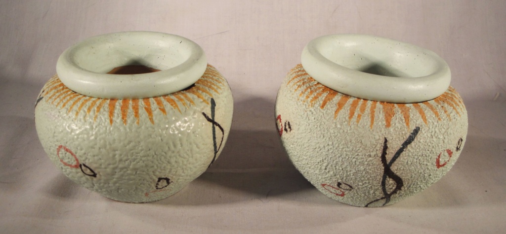 Can anyone help with this pair of Italian Candle Holders Italia10