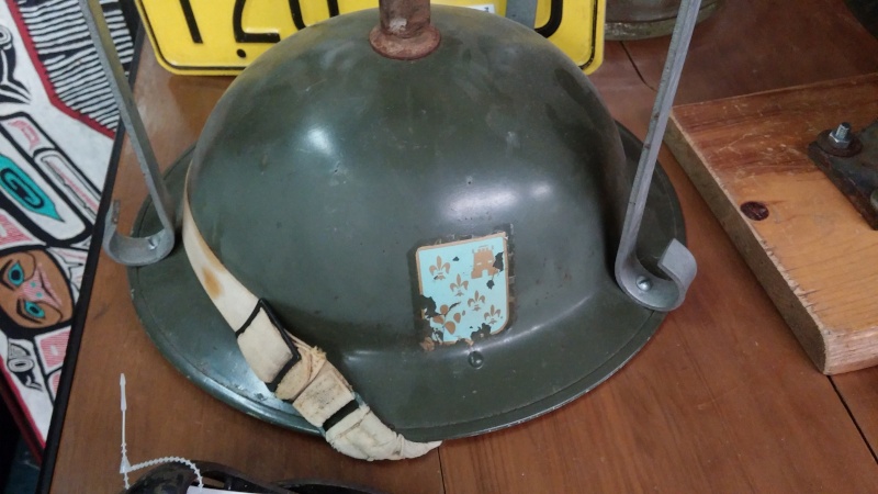 Sad fate for a couple of Canadian Mk II helmets with decals... 0510