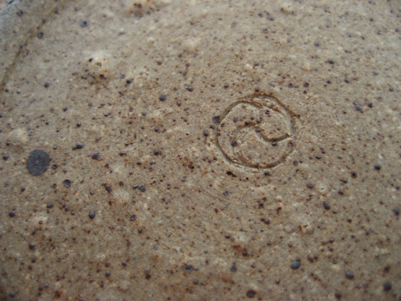  Stoneware dish, green glaze inside, mark =incised 3 arm swirl and grey dot Img_0343