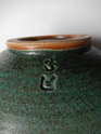 Stoneware bowl, two tone mottled green glaze, two impressed marks... Dscn2422