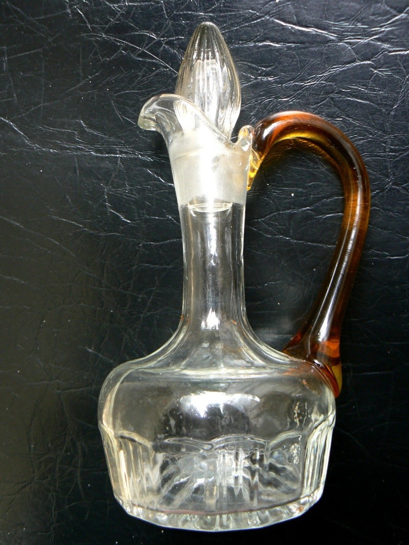 Small Glass jug blown amber handle,any id ? A210