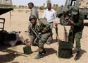 ليبيا: القوات الموالية للقذافى تقصف المعارضين عند الحدود مع تونس Ouousu40