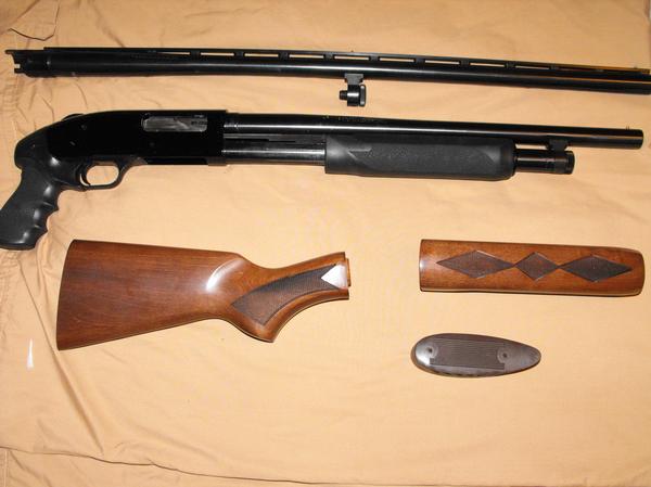 nice mossberg defender  with extras L_ad8611