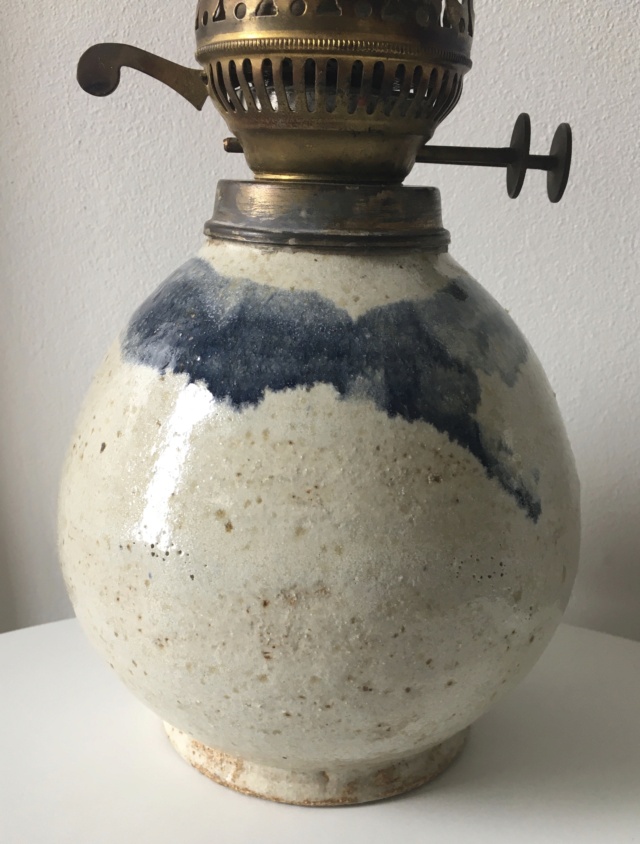 Unusual stoneware base to an oil burner. paper labels on base 54946a10