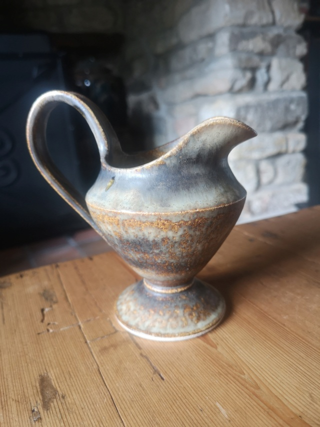 Elegant mottled brown jug with flared foot.  Img_2131
