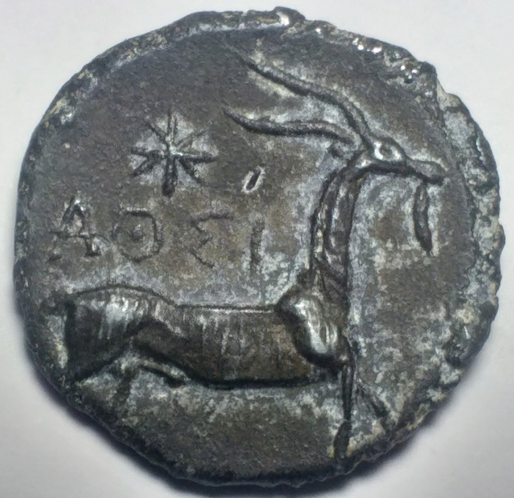 Ayuda para identificar esta moneda 117