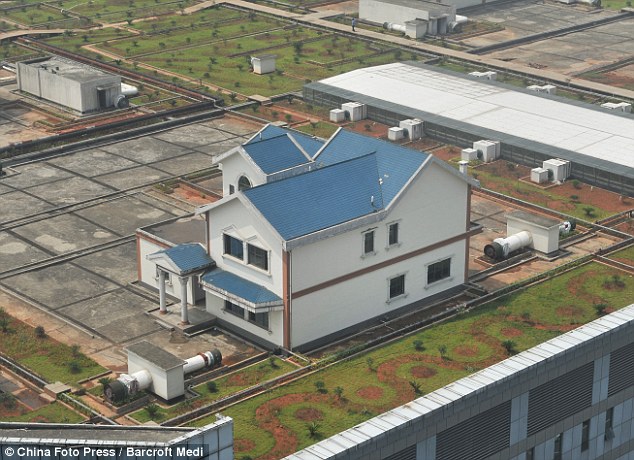 Maisons sur le toit d'un centre commercial, Xian de Zhuzhou - Chine Mai210