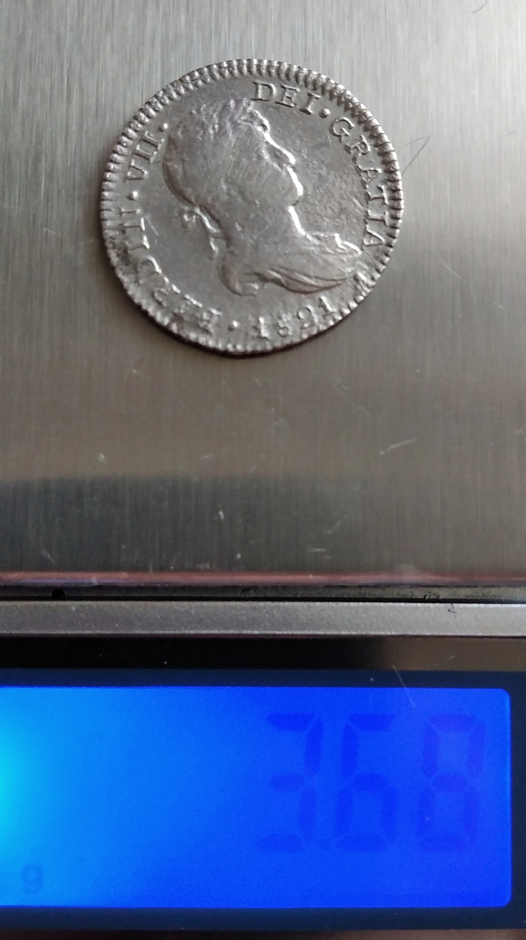Por favor ayúdame a identificar la moneda. 16669412