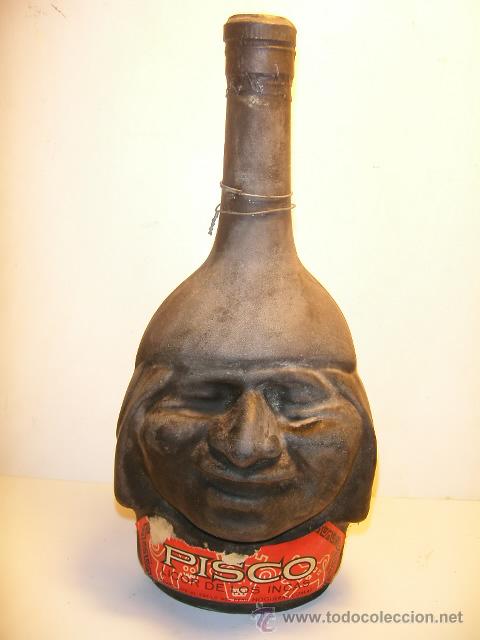 Bouteille ancienne en grès forme de visage ? 19722710