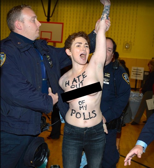 Two Unclad Ladies Protesting Against Donald Trump's Victory Arrested By Police  44612210