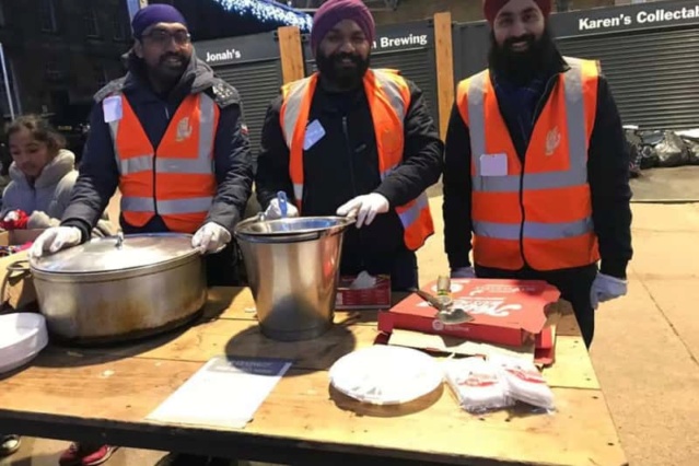 Sikh Seva Society UK and supporters give hot food and gifts to homeless in the city A0157610