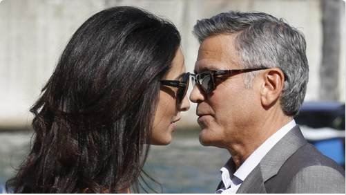 26 September 2014: George Clooney and Amal in a water taxi in Venice Kiss13