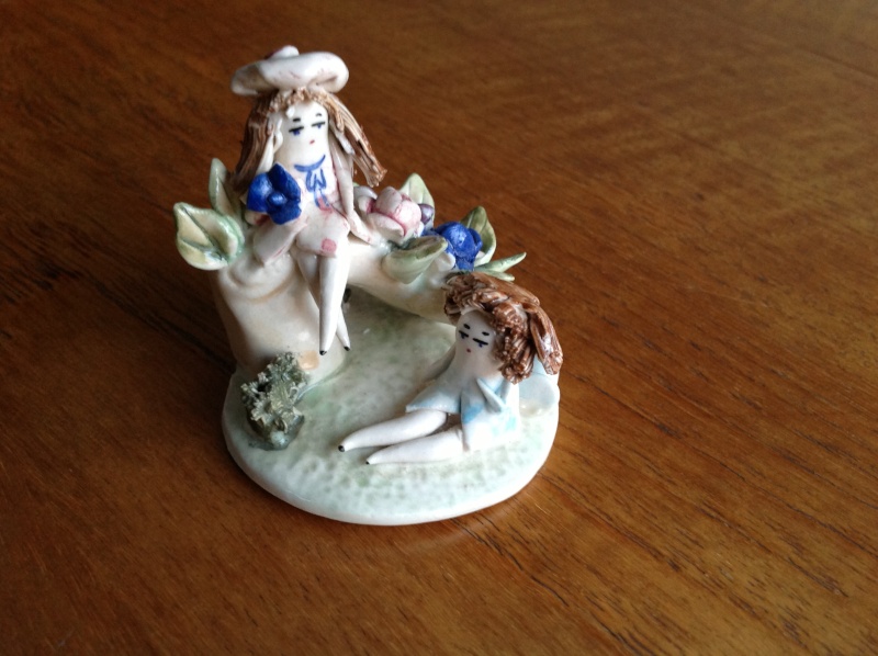 Tiny unmarked porcelain figurine 2014-200