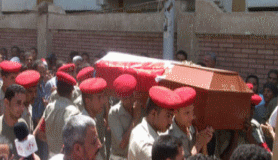 جنازة عسكرية لثلاثة من عناصر الشرطة بعد استشهادهم فى حريق بأكتوبر 221