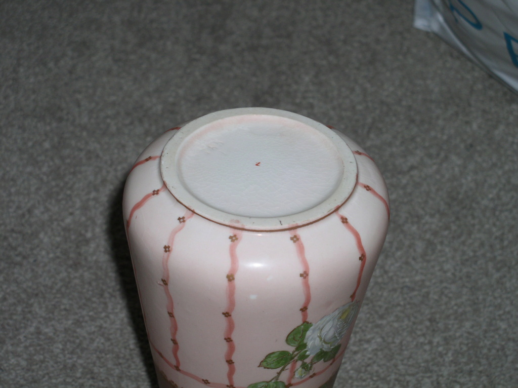 Unusual urn shaped two handled pair of vases with raised floral decoration P1010364
