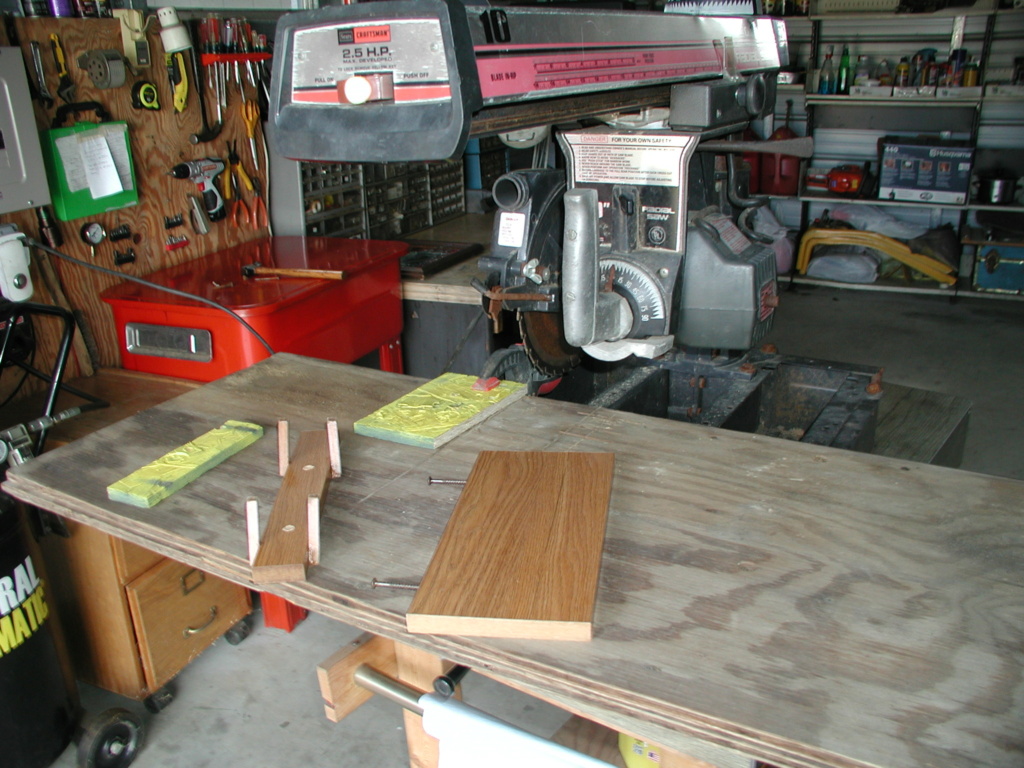 A Craftsman radial saw, the constructed Tyco Cosmic Wind display rack, and the burn pile P1012613