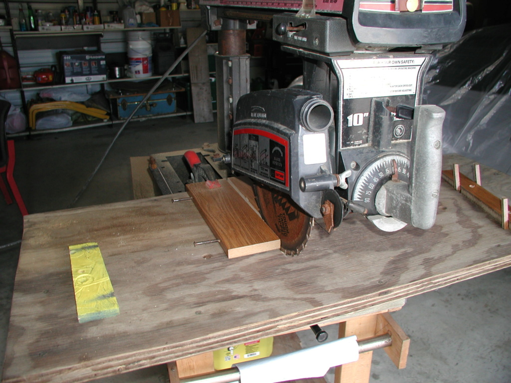 A Craftsman radial saw, the constructed Tyco Cosmic Wind display rack, and the burn pile P1012615