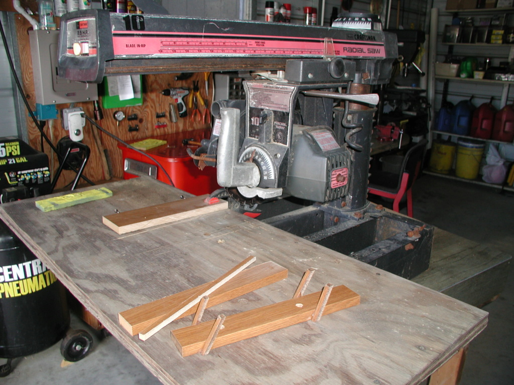 A Craftsman radial saw, the constructed Tyco Cosmic Wind display rack, and the burn pile P1012617