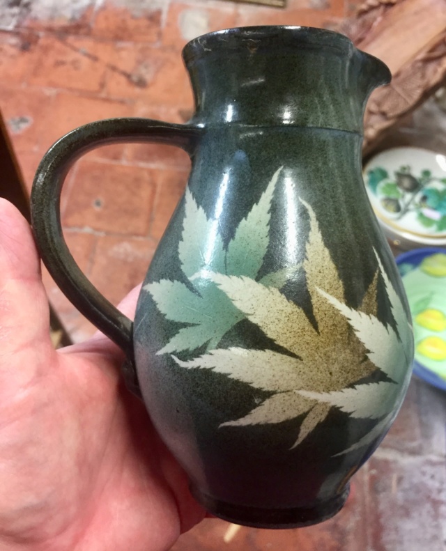 Leaf decorated jug, signed 7c064e10