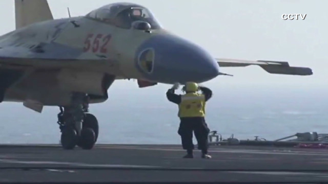 Chinese Land First Jet on its Aircraft Carrier 12112510