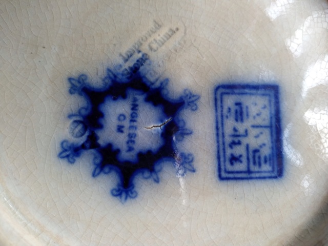 help to id stoneware pottery plate 00212