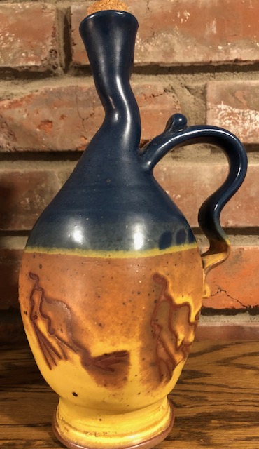 Curious of pottery oil bottle maker, signature illegible to me Oil110