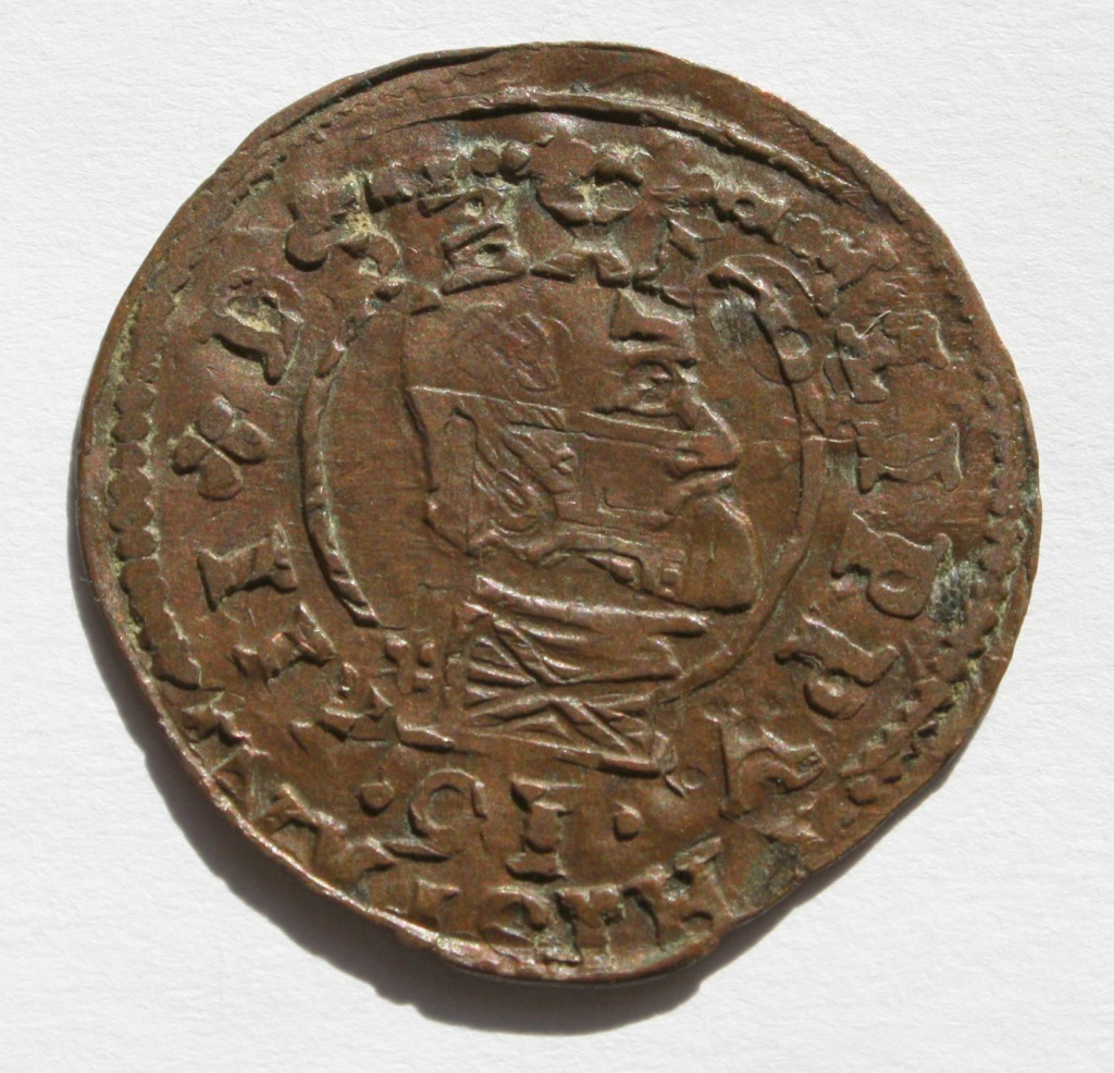 Doble acuñación en una moneda a rodillo. 16 maravedís de Felipe IV, Madrid. Felipe12