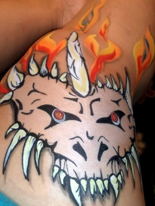Doodling on my leg, one stroke hearts and dragon skulls...  Finish10