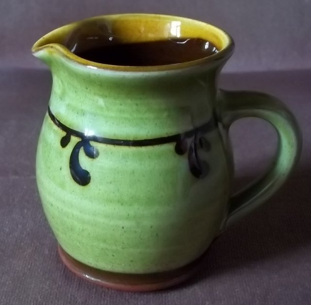 Small terracotta slip decorated jug 100_5177