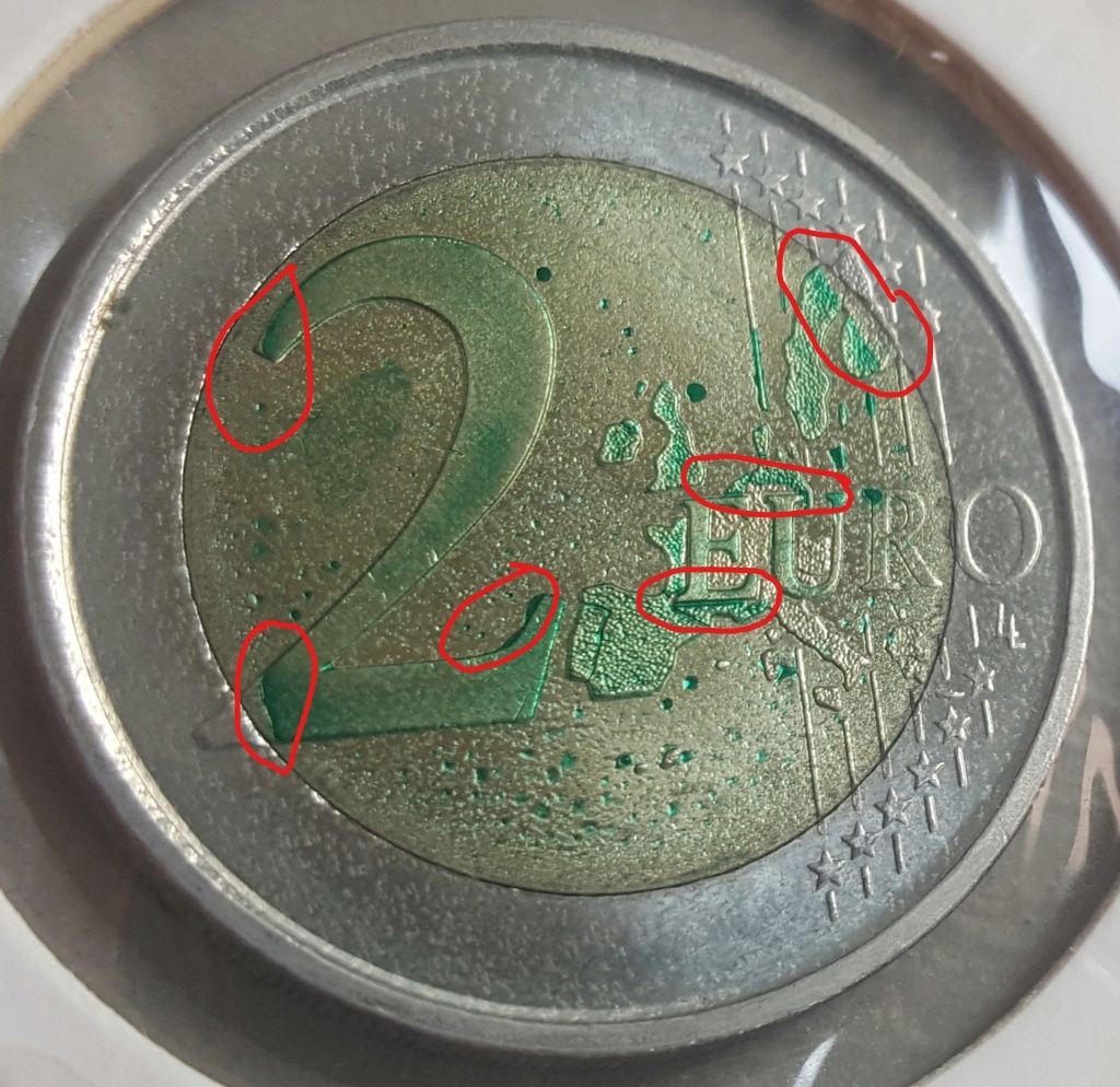 manchas en monedas de euro Inked210