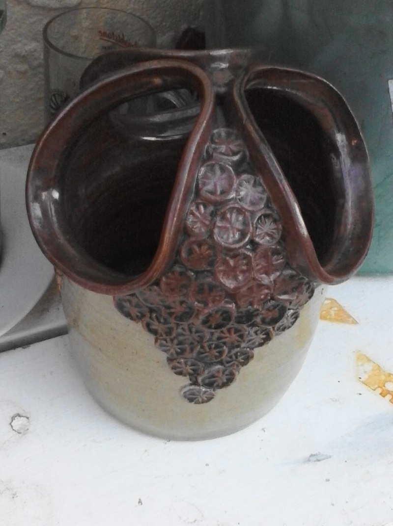 Very distinctive decoration on this quirky pot, does anyone recognise it? Cam01111