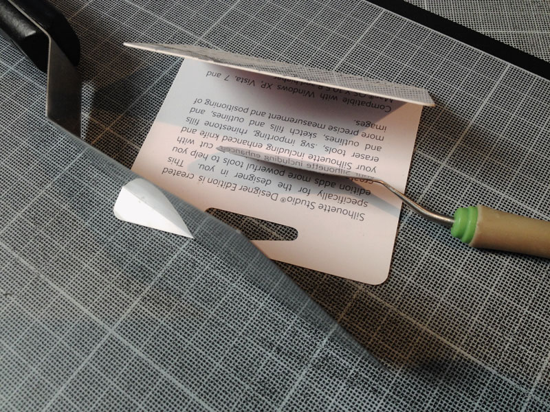 enlever les petits morceaux de papiers sur feuille de transp Spatul11