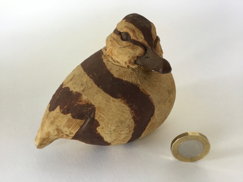 Earthenware bird, painted brown, unglazed, impressed mark unclear 1cafd610