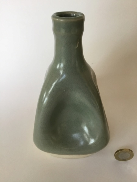 Squashed studio bottle, celadon glaze, rouletted cross mark  91d4ba10