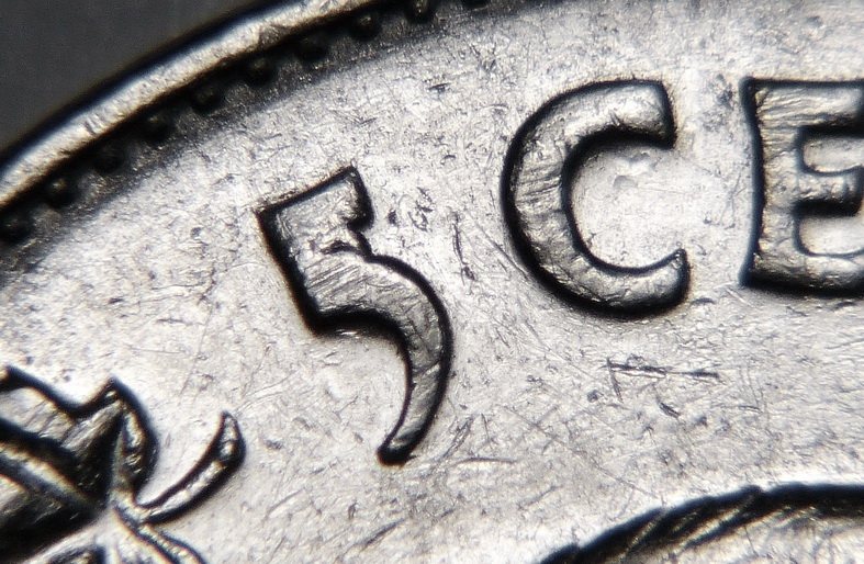 1977 - H7 - Éclat de coin sur 5 (Die chip on 5) Ca_0_180