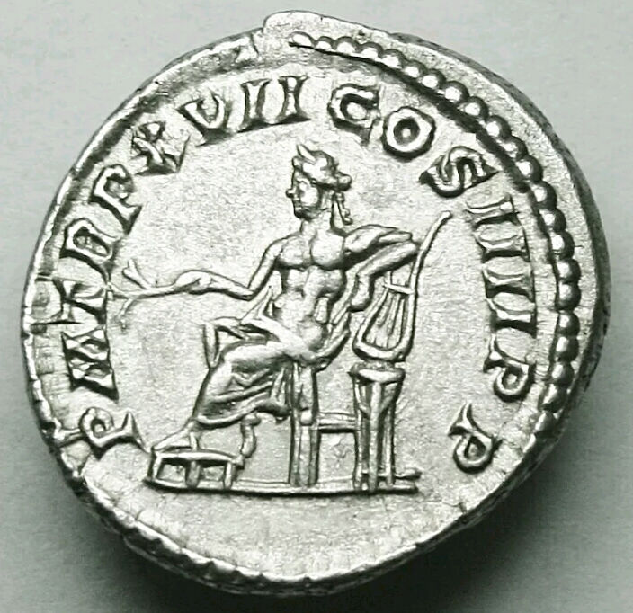 Denario de Caracalla. P M TR P XVII COS IIII P P. Apolo, sedente a izq. Ceca Roma. Captur28