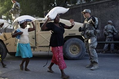 Chaos eases as Haiti food lines focus on women Haitir10