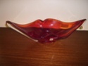 Red art glass centrepiece with label Pb100010