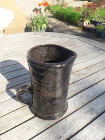 Dark glazed jug - unusually low handle - stylised mark CB? 20230422