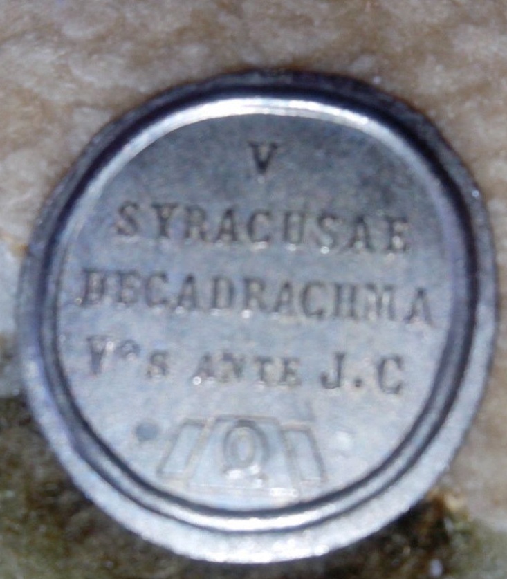 objeto similar a moneda 212