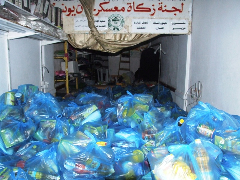  زكاة معسكر خان يونس تواصل توزيع الطرود الغذائية Dscf2214