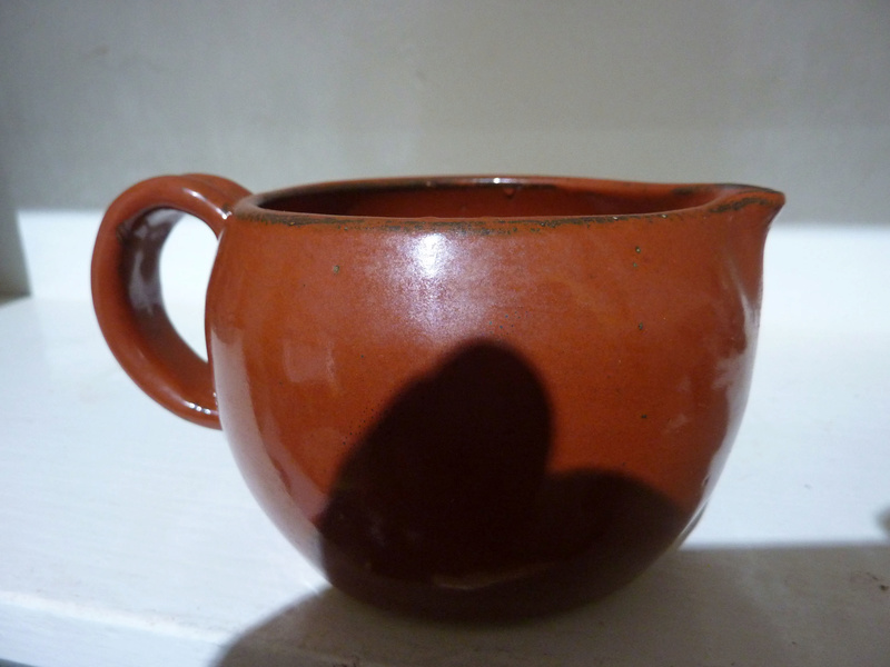 small pouring vessel marked JF 00117