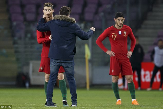 Cristiano Ronaldo kissed by excited pitch invader 4a94b210