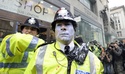 Police struggle to control hard-core anarchist rioters after 500,000-strong London march against government cuts ends in violence  Cop10