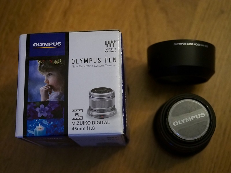 [Vendu] Olympus 45mm f1.8 Noir + pare soleil original Pb210014
