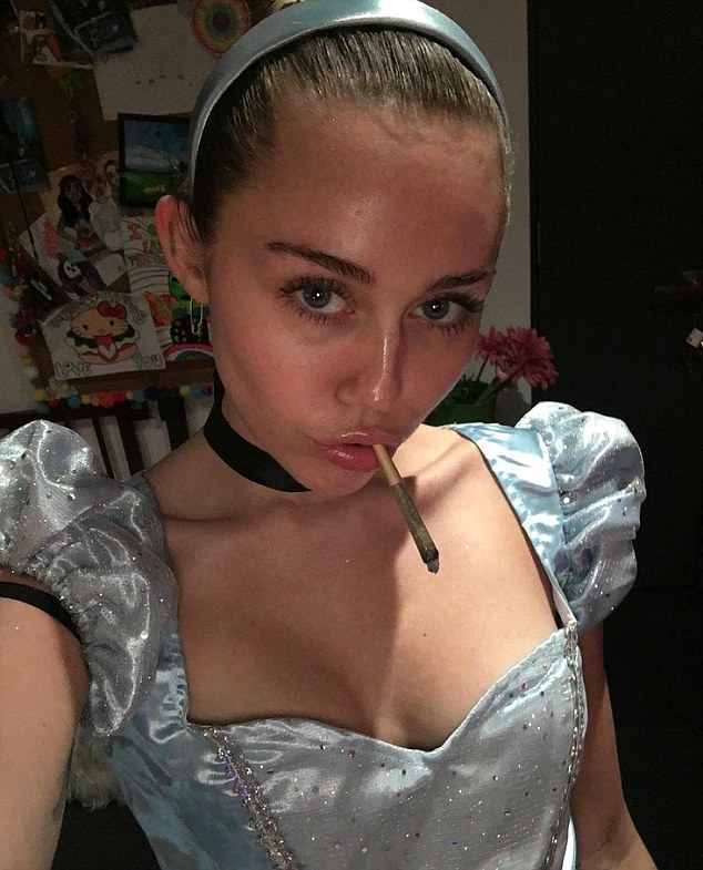 miley cyrus causes a stir when she lights up wearing a disney dress 2dfb5d10