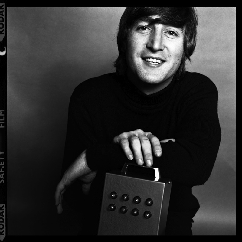 John Lennon's 'odd picture holding something that has 8 tiny bulbs and he died on Dec 8 John-l13
