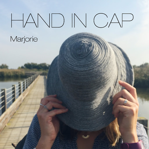 Marjorie-Hand_In_Cap-WEB-FR-2020-OND 00-mar10