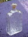 Clear textured bottle with 1950s/1960s cork stopper P2140010